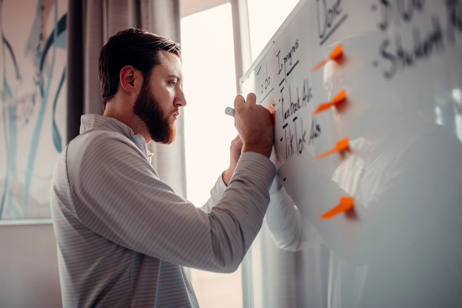 An entrepreneur sketching ideas on a whiteboard