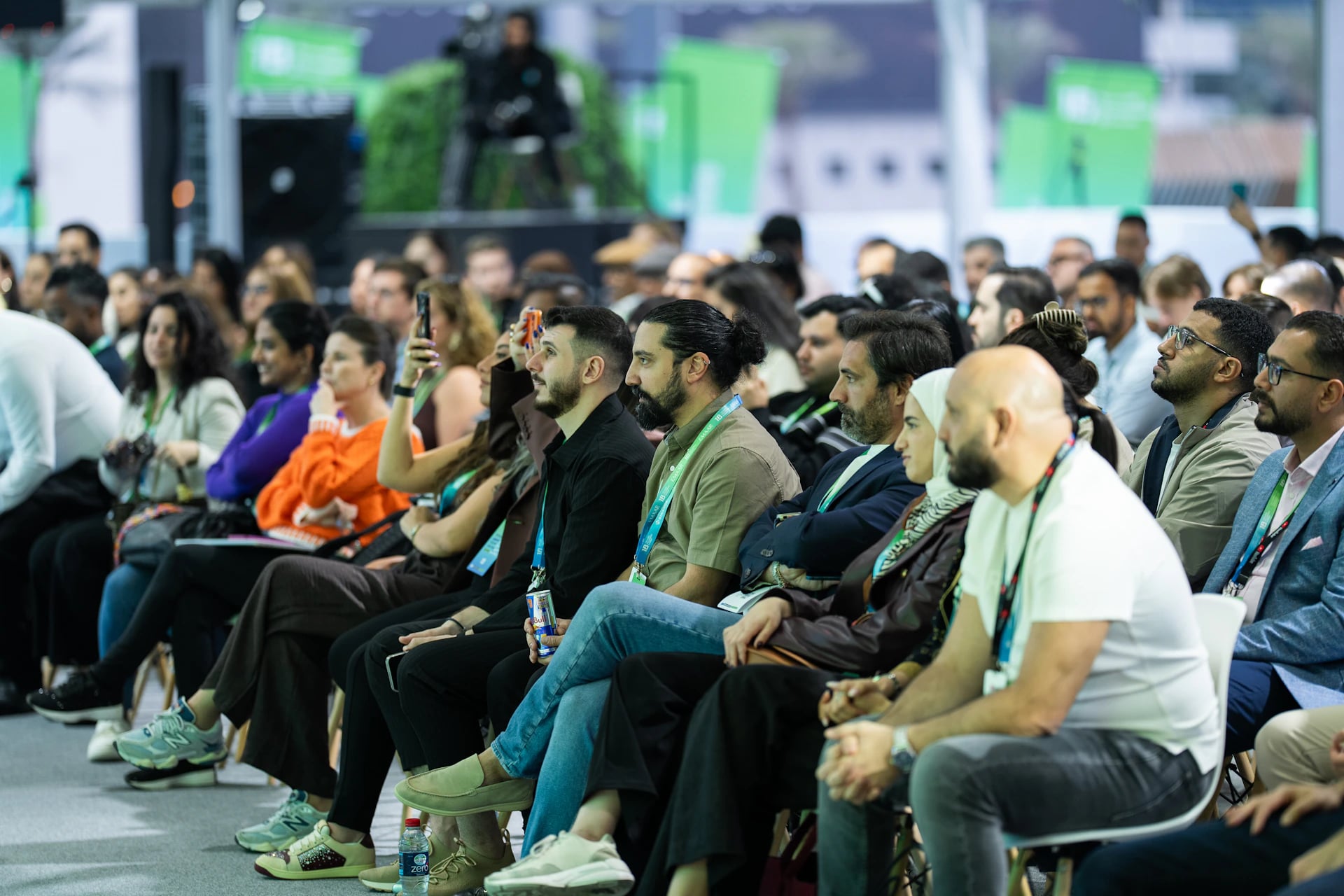 An audience listening to a conference session