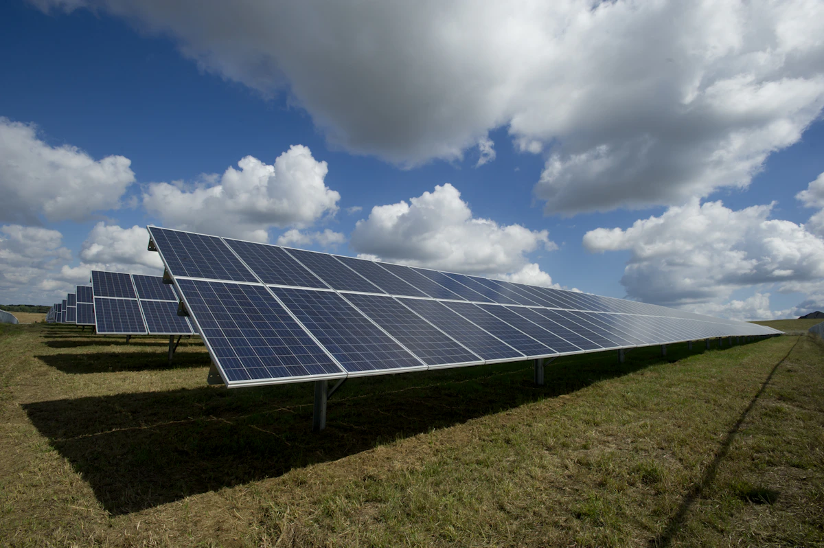 An array of solar panels in a field