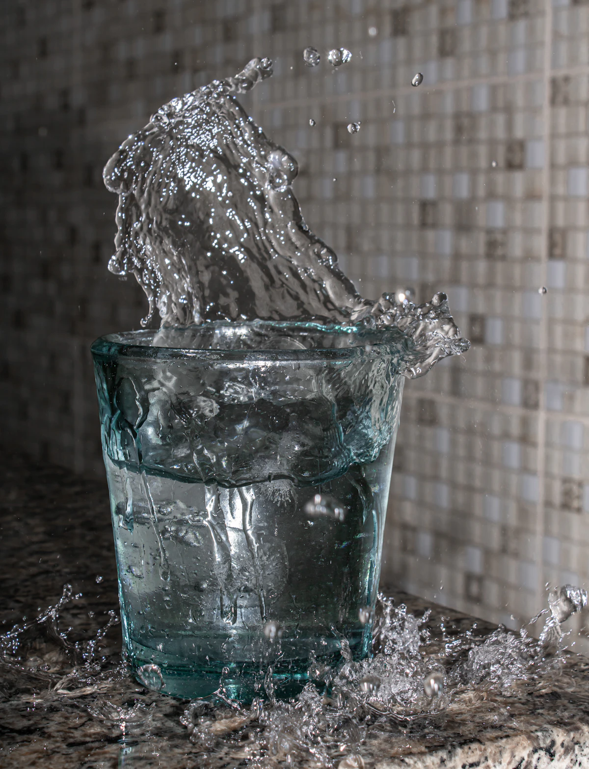 Water splashing in a drinking glass